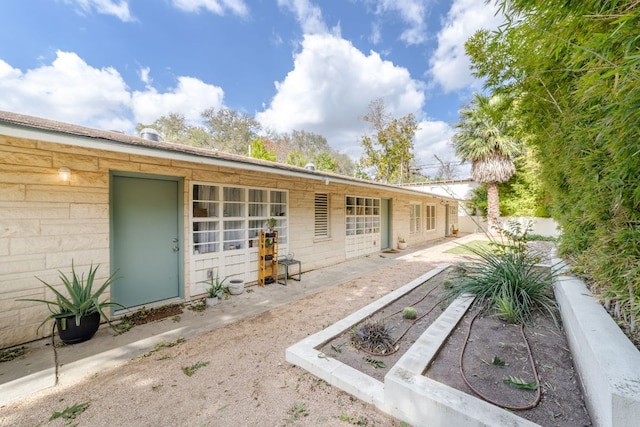 rear view of property featuring fence