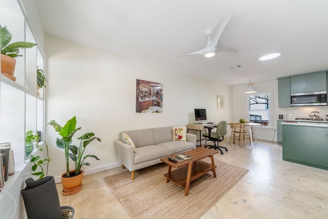239 Brahan Blvd, San Antonio, TX 78215 - living room with a desk, a ceiling fan, and baseboards
