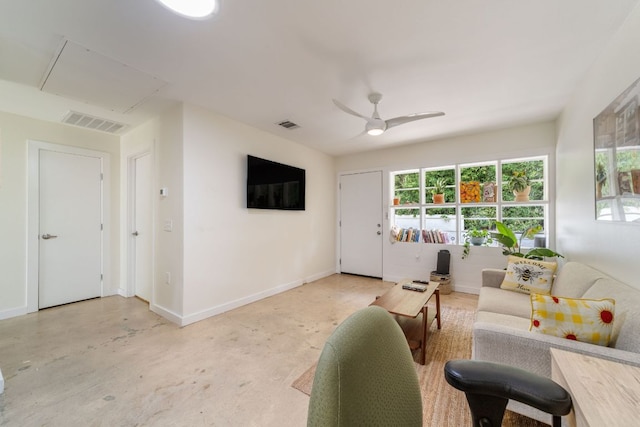 239 Brahan Blvd, San Antonio, TX 78215 - living room with concrete flooring, plenty of natural light, a ceiling fan, and attic access