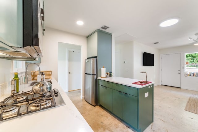 239 Brahan Blvd, San Antonio, TX 78215 - kitchen with green cabinets, stainless steel appliances, light countertops, and recessed lighting