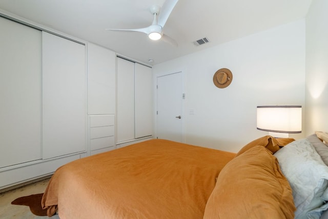 239 Brahan Blvd, San Antonio, TX 78215 - bedroom featuring multiple closets and a ceiling fan