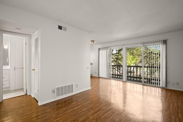620 S 1st St Unit 209, Austin, TX 78704 - unfurnished room featuring wood finished floors and a smoke detector