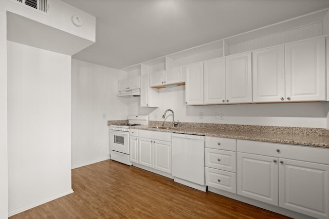 620 S 1st St Unit 209, Austin, TX 78704 - kitchen with white appliances, under cabinet range hood, white cabinets, and dark wood-type flooring