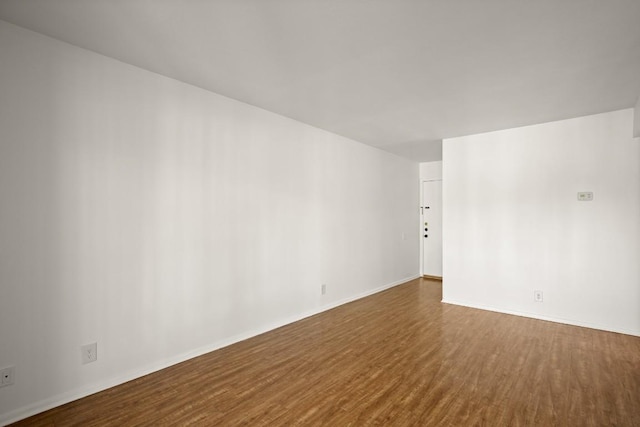 620 S 1st St Unit 209, Austin, TX 78704 - empty room featuring dark wood-type flooring and baseboards