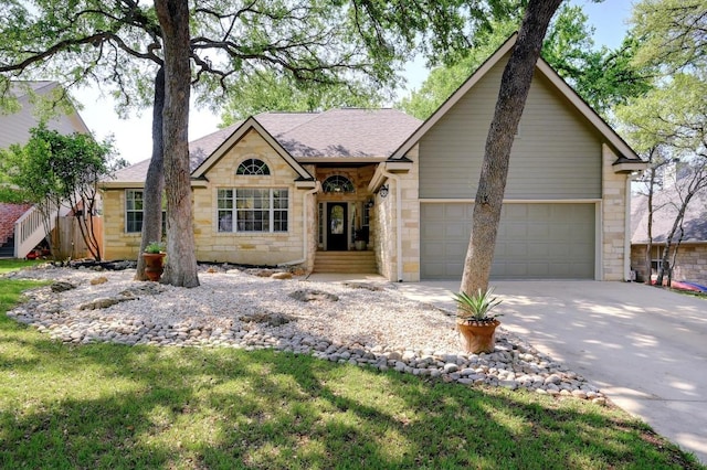single story home with roof with shingles, stone siding, a garage, and concrete driveway