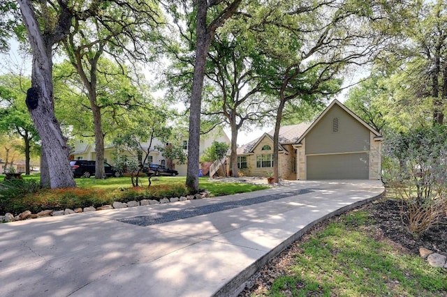 view of front of house with a garage and concrete driveway