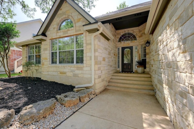 view of exterior entry with stone siding
