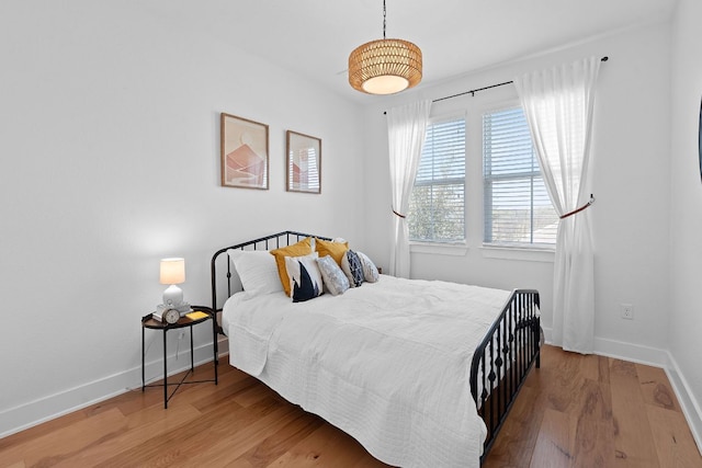 5911 Rubicon Run, Austin, TX 78745 - bedroom featuring wood finished floors and baseboards