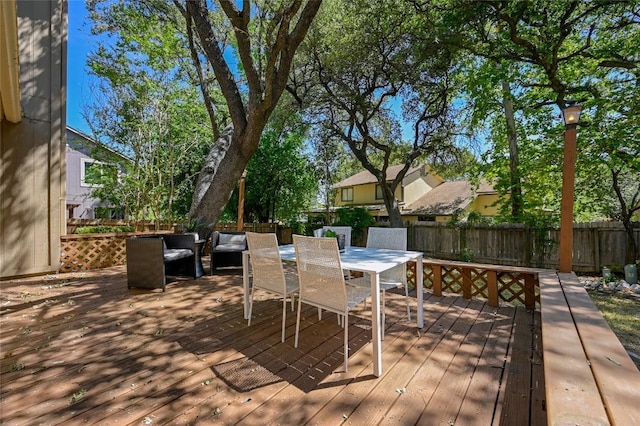 13109 New Boston Bnd, Austin, TX 78729 - wooden terrace featuring a fenced backyard, an outdoor hangout area, and outdoor dining area