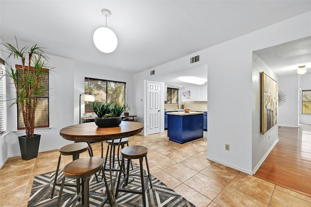 13109 New Boston Bnd, Austin, TX 78729 - dining room featuring light tile patterned floors and baseboards