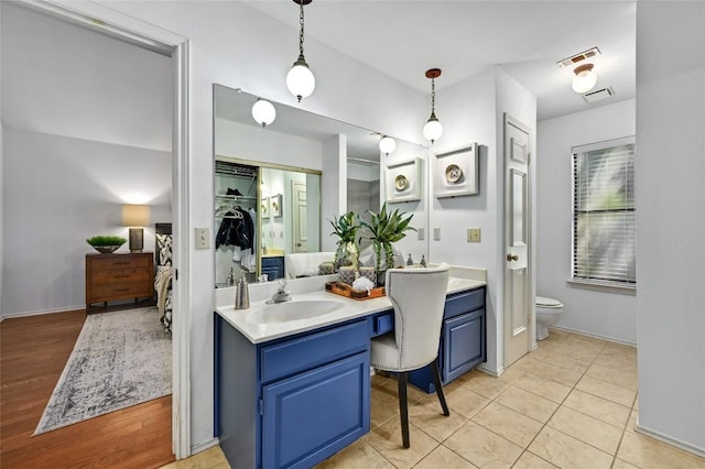 13109 New Boston Bnd, Austin, TX 78729 - full bathroom featuring vanity, toilet, and baseboards