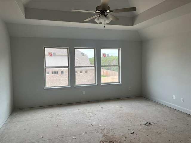 909 Landing Ln, Leander, TX 78641 - empty room featuring healthy amount of natural light, a ceiling fan, and a raised ceiling