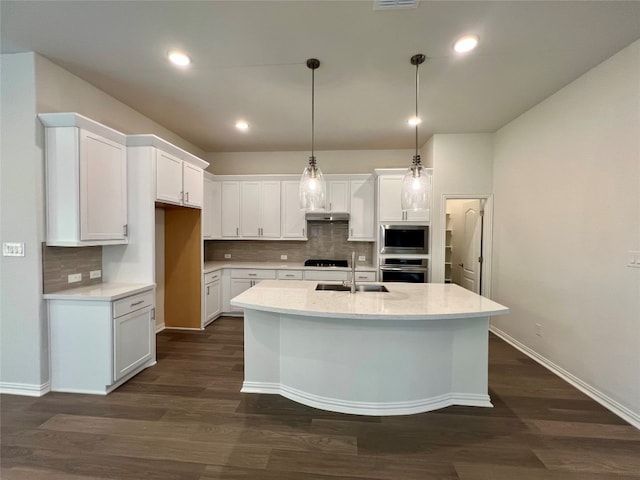 18204 Willow Sage Ln, Elgin, TX 78621 - kitchen featuring built in microwave, black cooktop, stainless steel oven, white cabinetry, and backsplash
