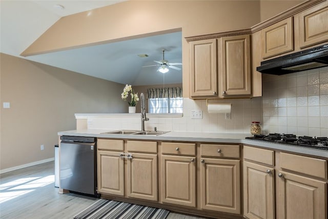9120 Fainwood Ln, Austin, TX 78749 - kitchen with dishwasher, black gas cooktop, light brown cabinetry, lofted ceiling, and decorative backsplash