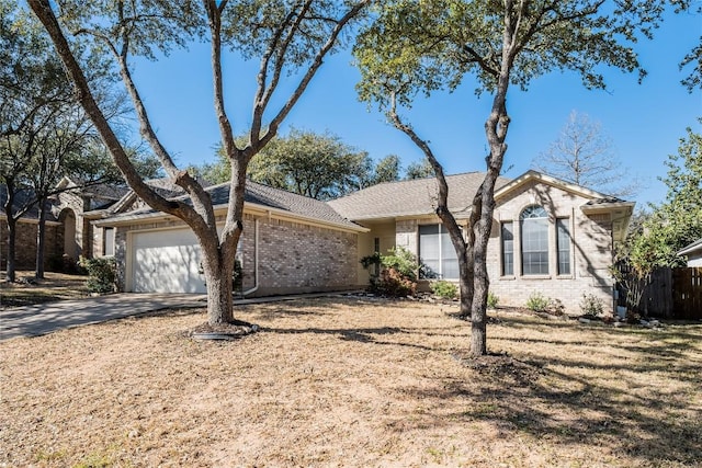 9120 Fainwood Ln, Austin, TX 78749 - single story home with brick siding, an attached garage, and driveway