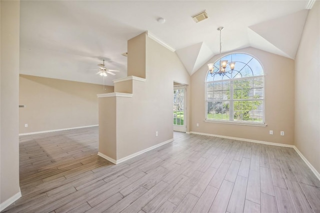9120 Fainwood Ln, Austin, TX 78749 - spare room with vaulted ceiling, wood finished floors, a chandelier, and ceiling fan
