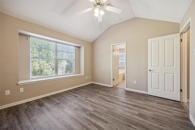 9120 Fainwood Ln, Austin, TX 78749 - unfurnished bedroom with wood finished floors, vaulted ceiling, ensuite bathroom, and a ceiling fan