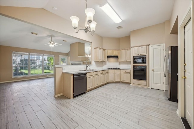 9120 Fainwood Ln, Austin, TX 78749 - kitchen with black appliances, vaulted ceiling, ceiling fan, a peninsula, and light wood-style floors