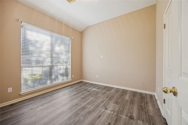 9120 Fainwood Ln, Austin, TX 78749 - unfurnished room with healthy amount of natural light, wood finished floors, and vaulted ceiling