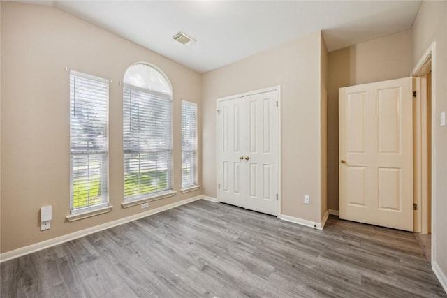 9120 Fainwood Ln, Austin, TX 78749 - unfurnished bedroom with wood finished floors and a closet