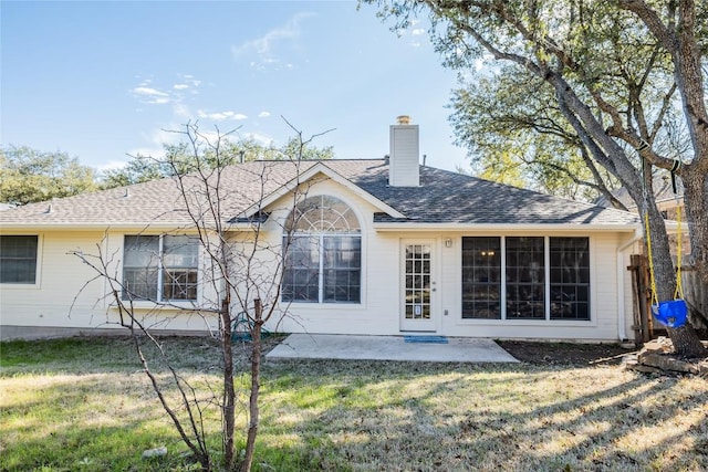9120 Fainwood Ln, Austin, TX 78749 - back of house with a chimney, a patio area, and roof with shingles