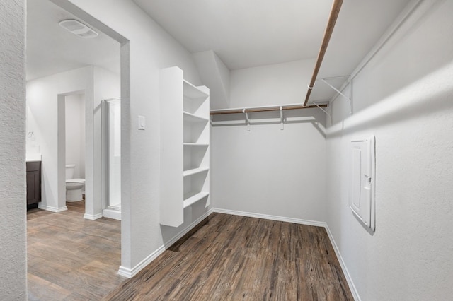 spacious closet with wood finished floors and visible vents