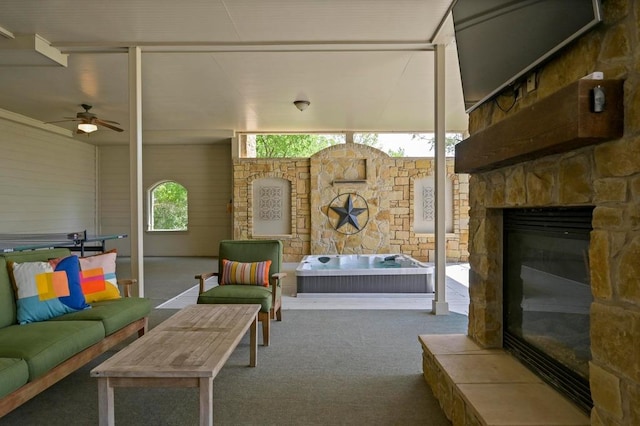 3416 Tarlton Ln, Austin, TX 78746 - living area with an outdoor stone fireplace, a ceiling fan, and carpet floors