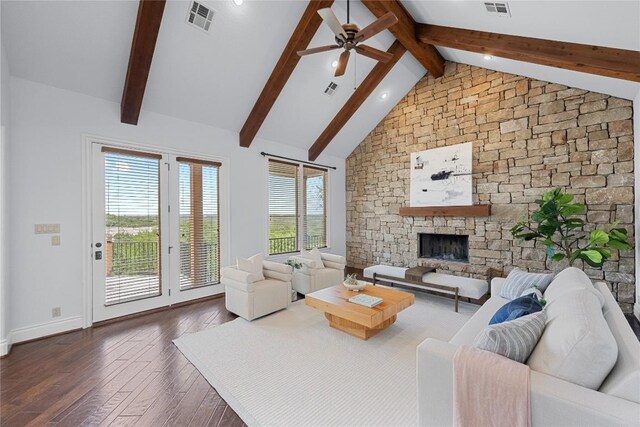 3416 Tarlton Ln, Austin, TX 78746 - living room featuring a stone fireplace, ceiling fan, dark wood-type flooring, and baseboards