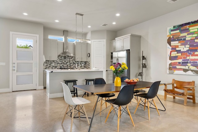 1210 Stobaugh St Unit A, Austin, TX 78757 - dining space with finished concrete floors and recessed lighting