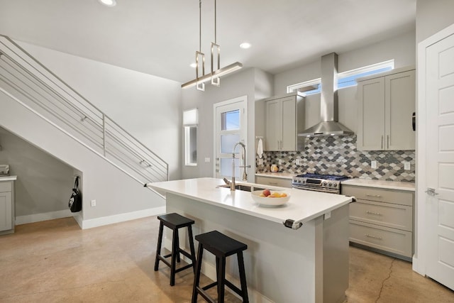 1210 Stobaugh St Unit A, Austin, TX 78757 - kitchen featuring wall chimney range hood, gray cabinetry, stainless steel gas range, finished concrete floors, and recessed lighting
