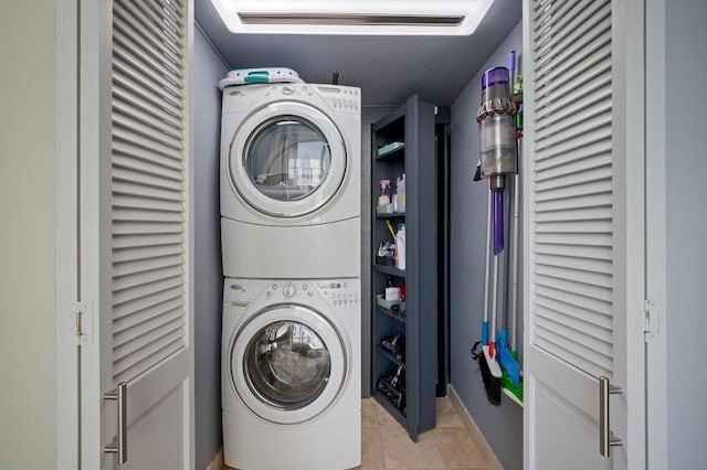 555 E 5th St Unit 2906, Austin, TX 78701 - laundry area with stacked washer / drying machine and light tile patterned floors