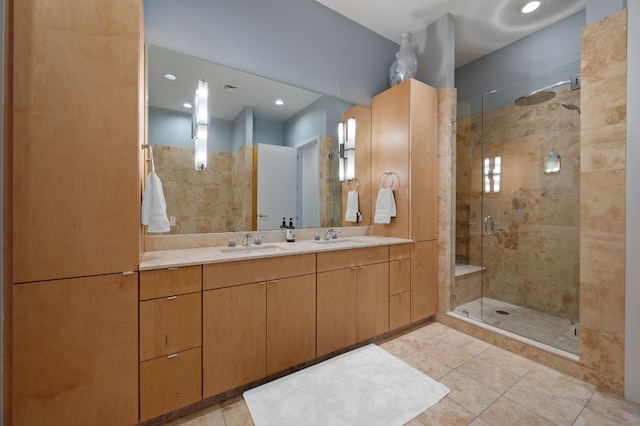 555 E 5th St Unit 2906, Austin, TX 78701 - bathroom with a shower stall, double vanity, tile patterned flooring, and recessed lighting
