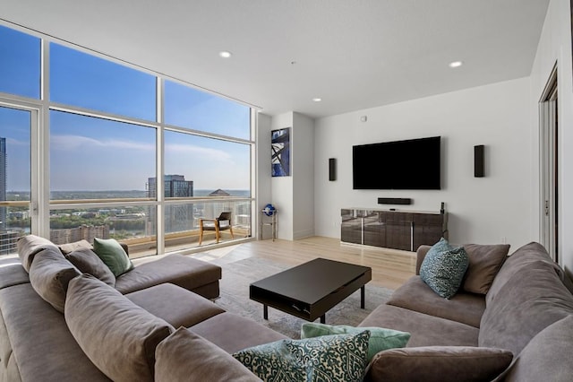555 E 5th St Unit 2906, Austin, TX 78701 - living area with wood finished floors, floor to ceiling windows, and recessed lighting