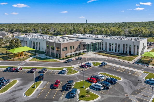 birds eye view of property with a view of trees