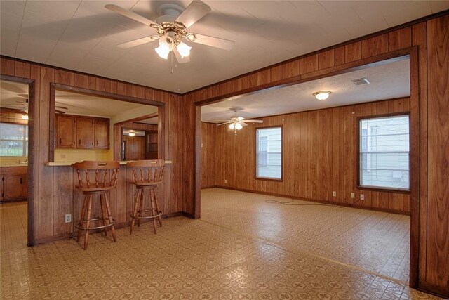 1116-C Simpson St, Schulenburg, TX 78956 - kitchen featuring baseboards, visible vents, brown cabinetry, and a ceiling fan