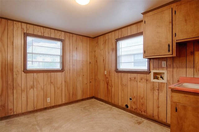1116-C Simpson St, Schulenburg, TX 78956 - unfurnished room featuring baseboards, concrete floors, and wood walls