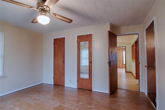 1116-C Simpson St, Schulenburg, TX 78956 - unfurnished bedroom with baseboards, ceiling fan, and wood finished floors