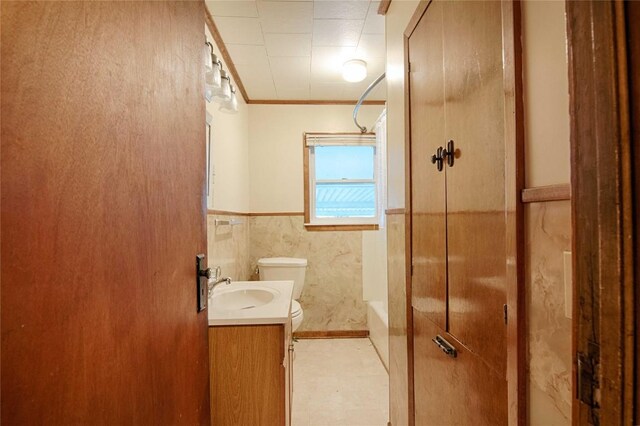 1116-C Simpson St, Schulenburg, TX 78956 - full bath featuring vanity, crown molding, toilet, and wainscoting
