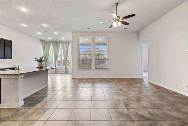 6725 Verona Pl, Round Rock, TX 78665 - unfurnished living room with ceiling fan and recessed lighting