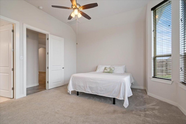6725 Verona Pl, Round Rock, TX 78665 - bedroom with carpet floors, multiple windows, arched walkways, a ceiling fan, and vaulted ceiling