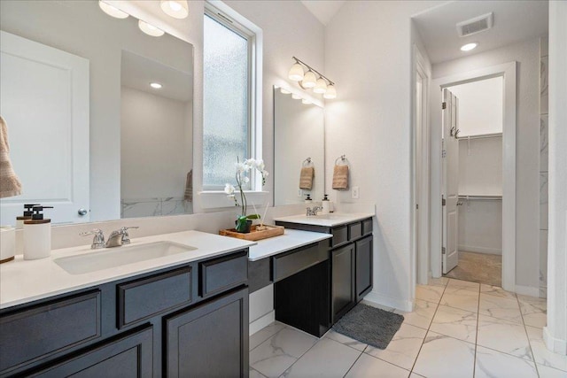 6725 Verona Pl, Round Rock, TX 78665 - full bath with marble look tile flooring, double vanity, and a spacious closet