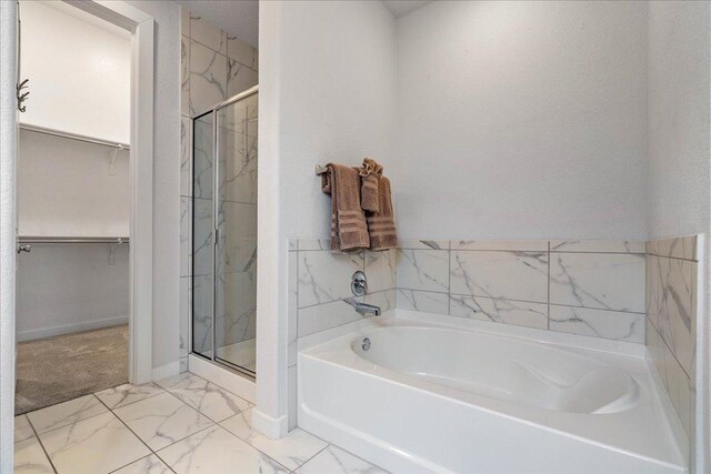 6725 Verona Pl, Round Rock, TX 78665 - full bath with a bath, a spacious closet, a marble finish shower, and marble finish floors