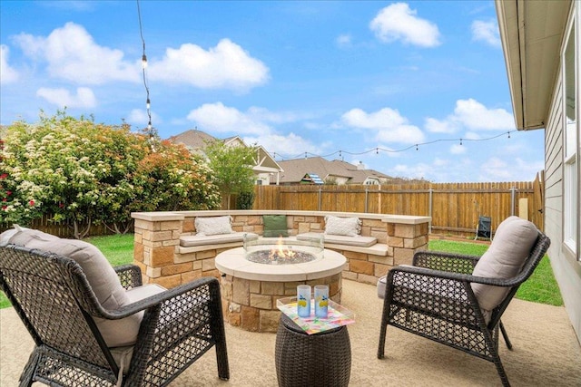 view of patio featuring a fire pit and a fenced backyard