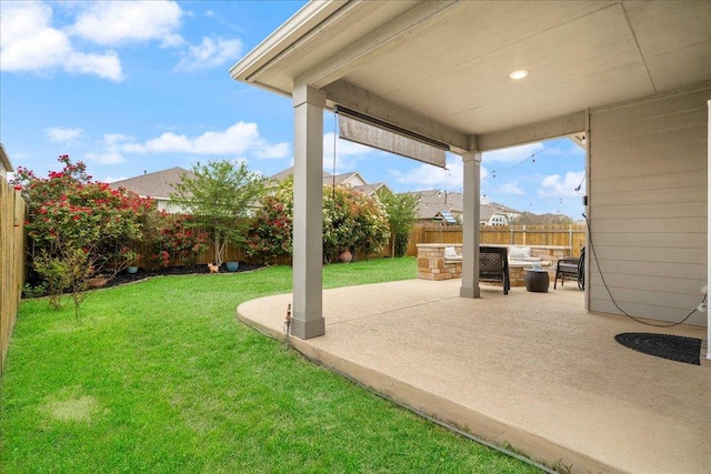view of yard featuring a fenced backyard, a patio, and an outdoor hangout area