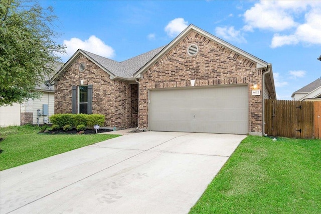 ranch-style house with a garage, brick siding, concrete driveway, and fence