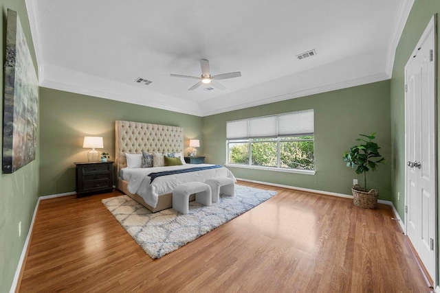 6520 Walebridge Ln, Austin, TX 78739 - bedroom with wood finished floors, ornamental molding, and a ceiling fan