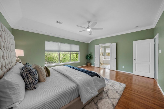 6520 Walebridge Ln, Austin, TX 78739 - bedroom with crown molding, wood finished floors, a ceiling fan, and ensuite bathroom