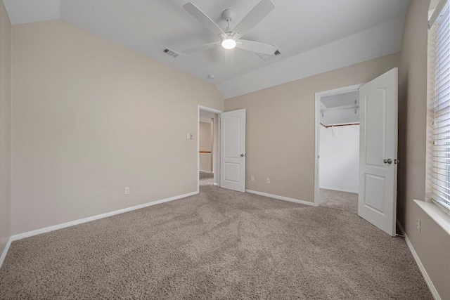 6520 Walebridge Ln, Austin, TX 78739 - unfurnished bedroom with lofted ceiling, carpet flooring, a walk in closet, ceiling fan, and a closet