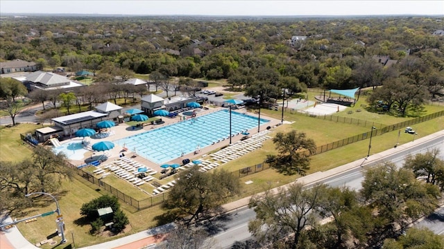6520 Walebridge Ln, Austin, TX 78739 - drone / aerial view of a pool and a heavily wooded area
