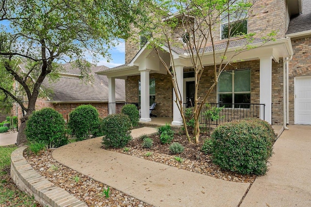 6520 Walebridge Ln, Austin, TX 78739 - view of front of property featuring covered porch, a chimney, brick siding, and a shingled roof